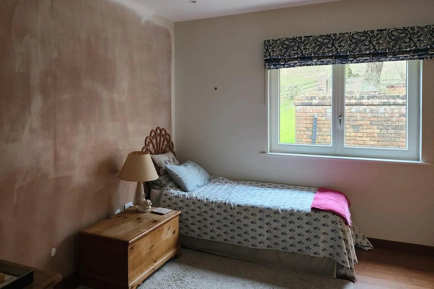 Bedroom stripped back to bare plaster before wallpapering